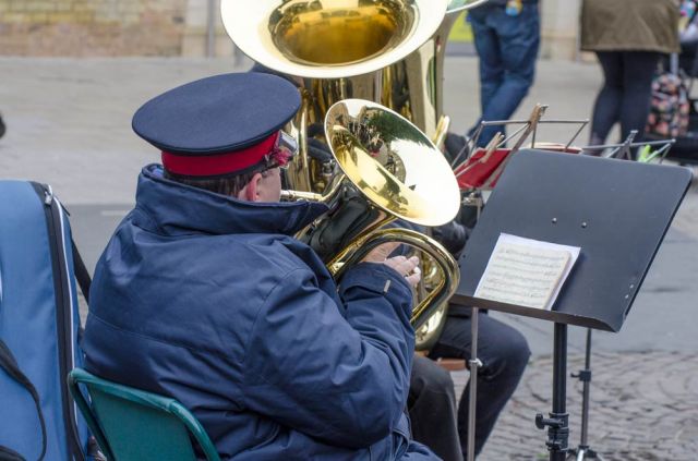 Salvation Army band member in uniform playing in Cambridge