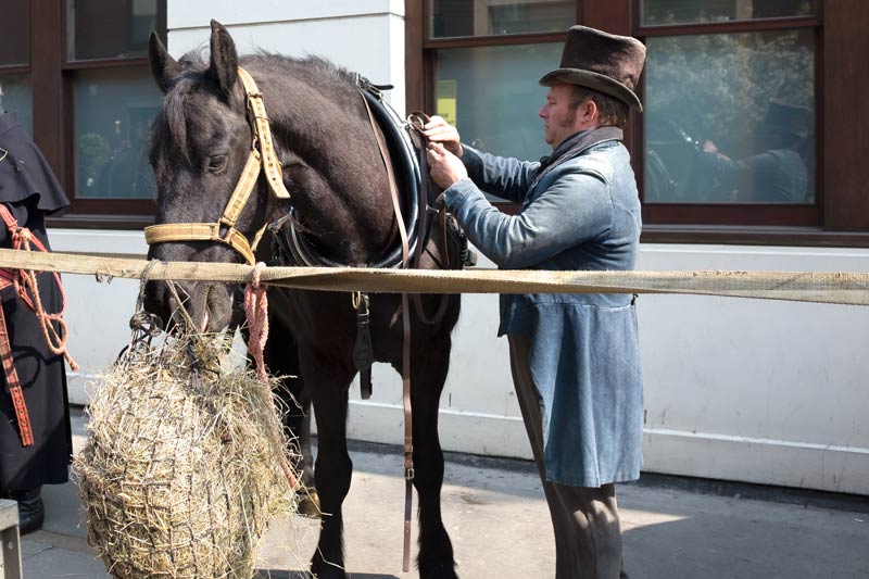 Horse with person in period costume near Fitzroy Square for the filming of Ammonite, about the life and love of Mary Anning