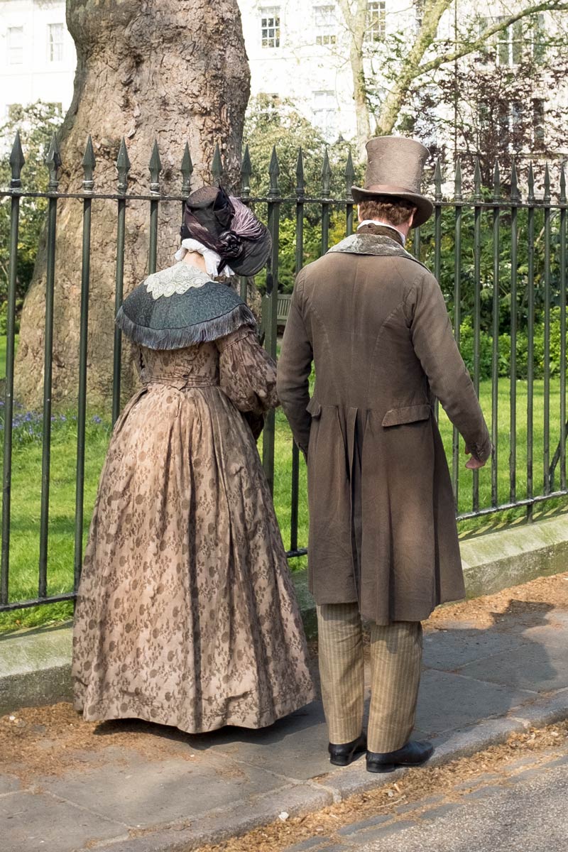 Couple in period costume in Fitzroy Square, London