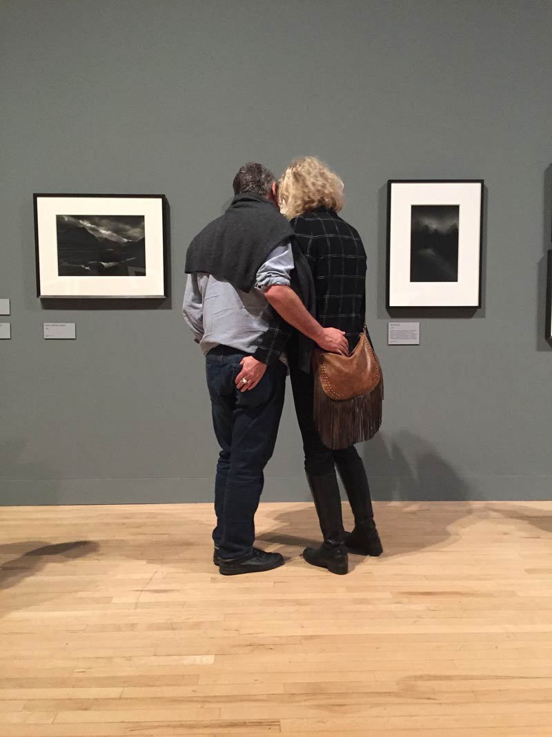 Couple look at Don McCullin photo at the Tate Modern exhibition.
