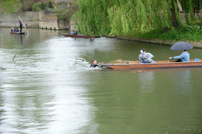 man overboard punting on the River Cam at Cambridge