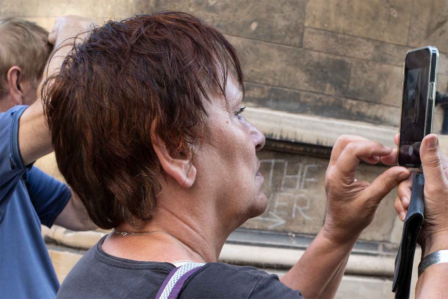 woman looking down Trinity Lane in Cambridge