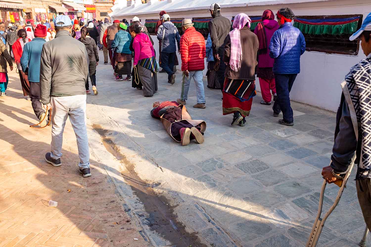 people making their way around the stupa in Boudhanath
