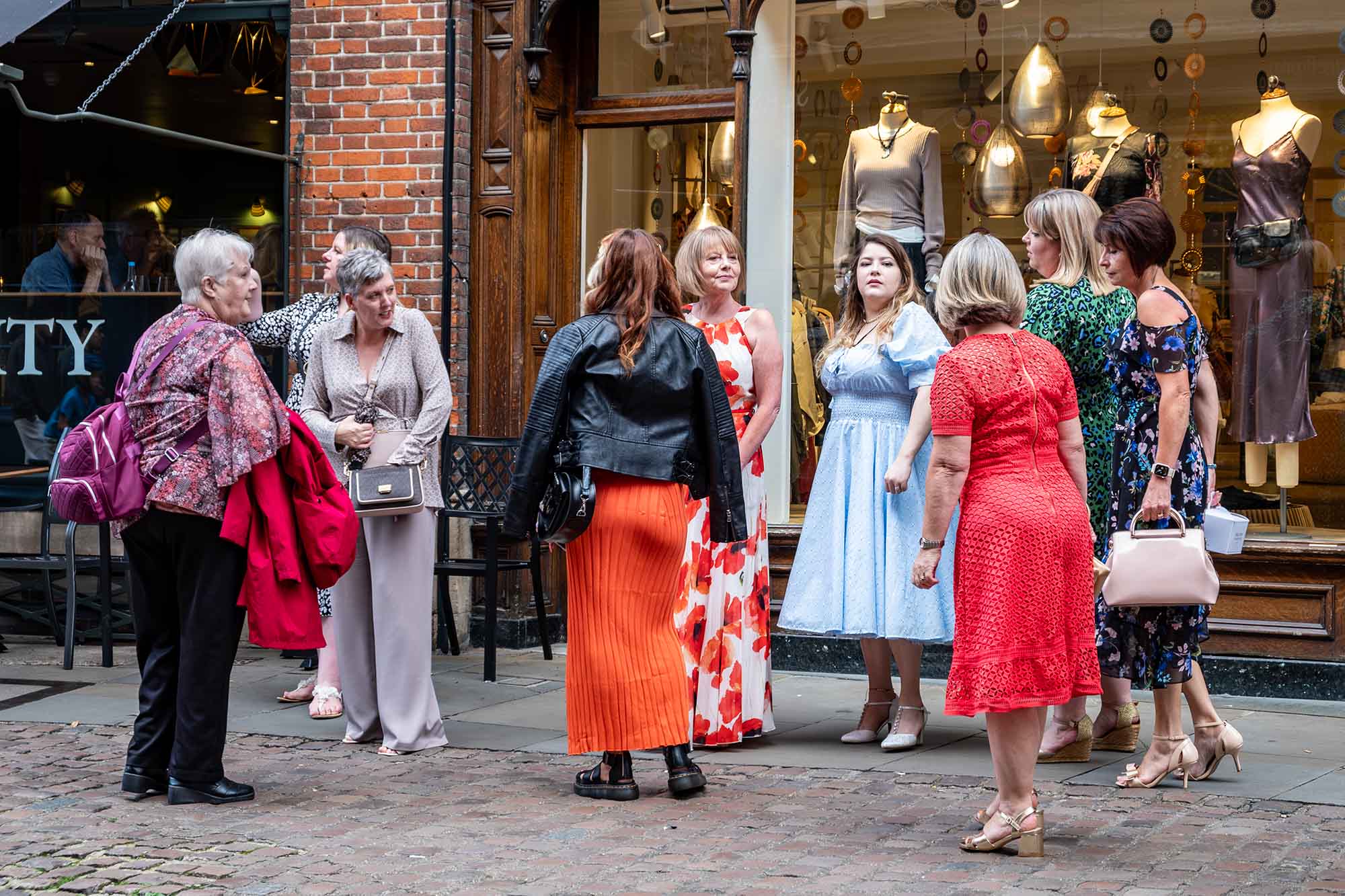 Women parting ways after being out in town in Cambridge